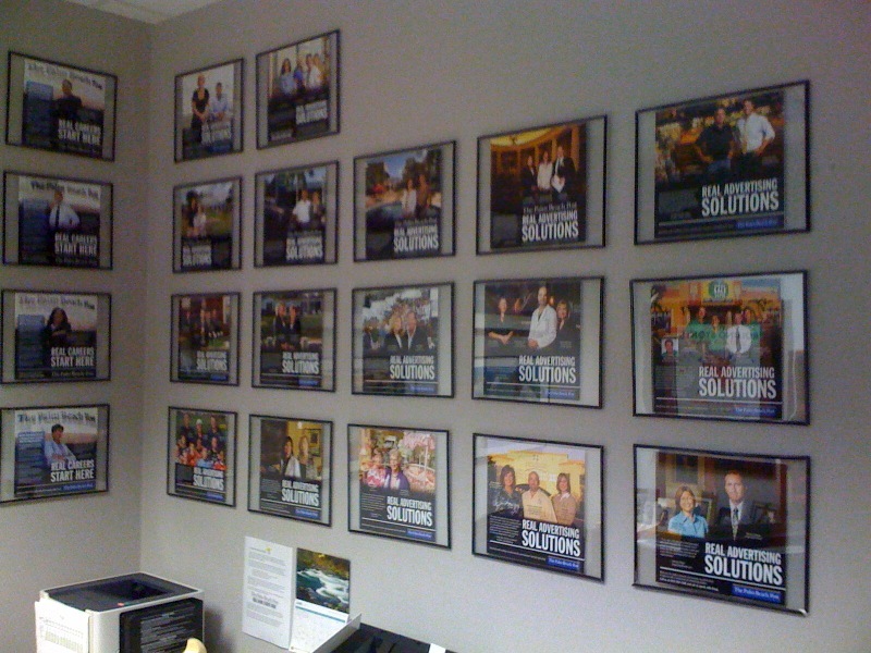 The Wall of Fame. Girardi's office wall is covered in new client testimonials.